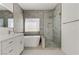 Elegant bathroom featuring a freestanding tub and a large shower at 9570 Wenmarie Ct, Las Vegas, NV 89148