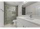 Modern bathroom with a large shower and white vanity at 9570 Wenmarie Ct, Las Vegas, NV 89148