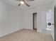 Charming bedroom with carpet, ceiling fan and laundry access at 9570 Wenmarie Ct, Las Vegas, NV 89148