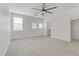 Bright bedroom with ceiling fan and carpet flooring at 9570 Wenmarie Ct, Las Vegas, NV 89148