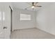 Cozy bedroom with carpet flooring and ceiling fan at 9570 Wenmarie Ct, Las Vegas, NV 89148