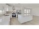 Modern kitchen featuring white cabinets, quartz countertops, and stainless steel appliances at 9570 Wenmarie Ct, Las Vegas, NV 89148