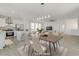 Bright kitchen with island, stainless steel appliances, and white cabinetry at 9570 Wenmarie Ct, Las Vegas, NV 89148