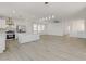 Modern kitchen with white cabinets, island, and stainless steel appliances at 9570 Wenmarie Ct, Las Vegas, NV 89148