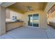 Covered patio with sliding doors and ceiling fan at 9570 Wenmarie Ct, Las Vegas, NV 89148