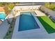 Modern rectangular pool with artificial turf at 9570 Wenmarie Ct, Las Vegas, NV 89148