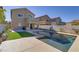 Luxury pool with artificial turf and a two-story home at 9570 Wenmarie Ct, Las Vegas, NV 89148