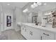 Elegant bathroom with double vanity and large mirror at 988 Via Panfilo Ave, Henderson, NV 89011