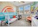 Adorable Bedroom features a crib, changing area, and playful decor at 988 Via Panfilo Ave, Henderson, NV 89011