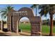 Entrance to the Chimera Golf Club, featuring a stone archway at 988 Via Panfilo Ave, Henderson, NV 89011