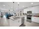 Open concept kitchen with island overlooking living room at 988 Via Panfilo Ave, Henderson, NV 89011