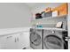 Modern laundry room with LG washer and dryer, and ample storage at 988 Via Panfilo Ave, Henderson, NV 89011