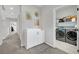 Convenient laundry area with washer, dryer and changing table at 988 Via Panfilo Ave, Henderson, NV 89011