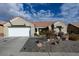 Single-story home with a landscaped front yard and attached garage at 9900 Rosamond Dr, Las Vegas, NV 89134