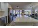 Updated kitchen, featuring white shaker cabinets and quartz countertops at 9900 Rosamond Dr, Las Vegas, NV 89134