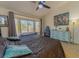 Main bedroom with bay window, ceiling fan, and light blue dresser at 9900 Rosamond Dr, Las Vegas, NV 89134