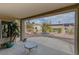 Covered patio with desert landscaping and a view of neighboring homes at 9900 Rosamond Dr, Las Vegas, NV 89134