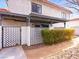 Townhouse entrance with pergola and decorative fencing at 1008 Willow Tree Dr # B, Las Vegas, NV 89128