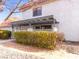 Inviting condo exterior featuring a covered patio and well-manicured landscaping at 1008 Willow Tree Dr # B, Las Vegas, NV 89128