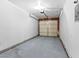 Attached single-car garage with an overhead door and light-colored walls at 1008 Willow Tree Dr # B, Las Vegas, NV 89128