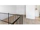 Loft space with metal railing and access to bathroom at 1008 Willow Tree Dr # B, Las Vegas, NV 89128