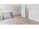 Bright loft with neutral carpeting and metal railing at 1008 Willow Tree Dr # B, Las Vegas, NV 89128