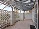 Covered patio area with brick wall and lattice fencing at 1008 Willow Tree Dr # B, Las Vegas, NV 89128