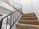 Interior staircase with metal railing, leading upstairs at 1008 Willow Tree Dr # B, Las Vegas, NV 89128