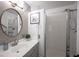 Clean bathroom with large mirror and shower at 1015 Aspen Breeze Ave, Las Vegas, NV 89123