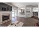 Spacious living room features a fireplace and views of the pool at 1015 Aspen Breeze Ave, Las Vegas, NV 89123