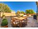 Private backyard has a patio area with desert landscaping and plenty of seating at 10260 Danskin Dr, Las Vegas, NV 89166