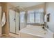 Bathroom with soaking tub and separate shower at 10260 Danskin Dr, Las Vegas, NV 89166