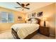 Bright bedroom with a comfortable bed, nightstands, and window coverings at 10260 Danskin Dr, Las Vegas, NV 89166