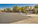 Gated community entrance with landscaping and signage at 10260 Danskin Dr, Las Vegas, NV 89166