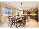 Kitchen dining area with wood table and chairs near kitchen at 10260 Danskin Dr, Las Vegas, NV 89166