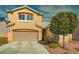 Two story house with attached garage and landscaping at 10260 Danskin Dr, Las Vegas, NV 89166