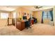 Spacious home office with two workstations, ample natural light, and carpeting at 10260 Danskin Dr, Las Vegas, NV 89166