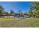 Community playground with playset and shaded seating at 10260 Danskin Dr, Las Vegas, NV 89166