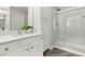 Bright bathroom boasts a quartz vanity, spacious shower, and modern fixtures at 104 Alamere Falls Dr, Las Vegas, NV 89138