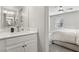 Guest bathroom with a vanity and view into the bedroom at 104 Alamere Falls Dr, Las Vegas, NV 89138