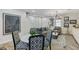 Open concept dining area with a round table and black and white patterned chairs at 104 Alamere Falls Dr, Las Vegas, NV 89138