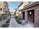 Brick front exterior of townhome with walkway and landscaping at 104 Alamere Falls Dr, Las Vegas, NV 89138