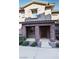 Two story townhome with a covered front porch at 104 Alamere Falls Dr, Las Vegas, NV 89138