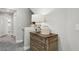 Bright hallway featuring a decorative table with drawers and access to other rooms at 104 Alamere Falls Dr, Las Vegas, NV 89138