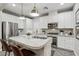 Gourmet kitchen featuring stainless steel appliances, an island and ample cabinet space at 104 Alamere Falls Dr, Las Vegas, NV 89138