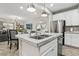 Kitchen island with granite countertop, double sink, and breakfast bar seating at 104 Alamere Falls Dr, Las Vegas, NV 89138