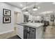 Modern kitchen with white cabinets, granite countertops, and stainless steel appliances at 104 Alamere Falls Dr, Las Vegas, NV 89138