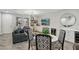 Stylish living room with a contemporary design, modern lighting and a dining area at 104 Alamere Falls Dr, Las Vegas, NV 89138