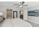 Spacious bedroom with a ceiling fan, TV, walk-in closet, and ensuite bathroom at 104 Alamere Falls Dr, Las Vegas, NV 89138