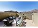 Private rooftop patio with seating area and fire pit at 104 Alamere Falls Dr, Las Vegas, NV 89138